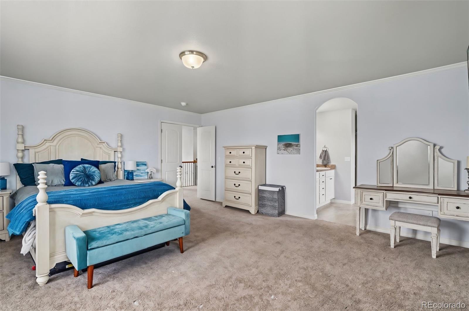 8271 White Fish Way Colorado Springs, CO 80908 - Photo 18 of 47 a bedroom with furniture and window
