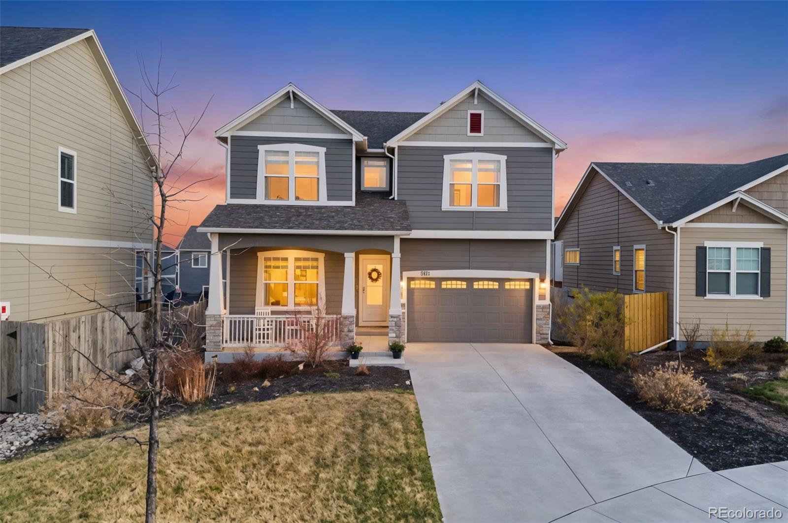 8271 White Fish Way Colorado Springs, CO 80908 - Photo 2 of 47 a front view of a house with garden