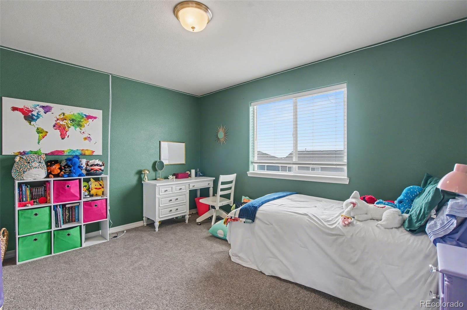 8271 White Fish Way Colorado Springs, CO 80908 - Photo 21 of 47 a bedroom with furniture and a window