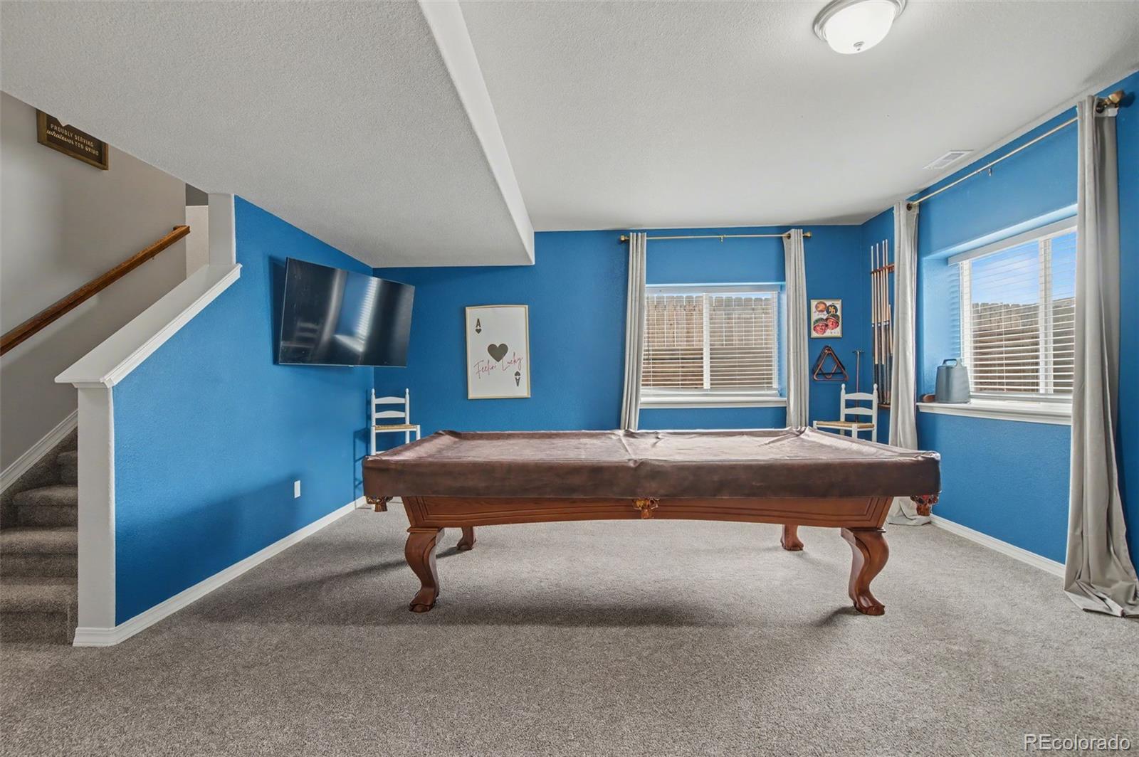 8271 White Fish Way Colorado Springs, CO 80908 - Photo 25 of 47 a room with pool table and windows
