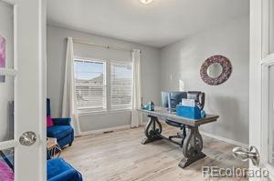 8271 White Fish Way Colorado Springs, CO 80908 - Photo 4 of 47 a view of a workspace with furniture and a window
