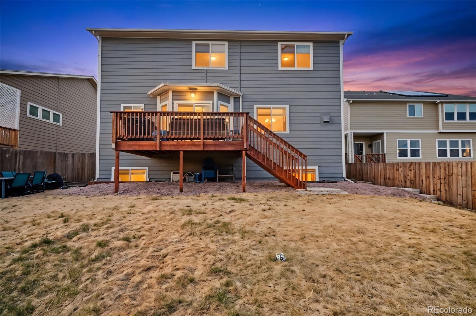 8271 White Fish Way Colorado Springs, CO 80908 - Photo 41 of 47 a view of a house with a yard