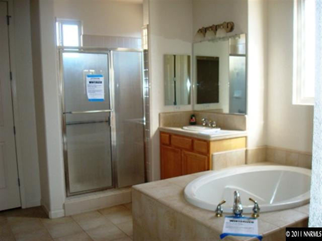 9848 Bridge View Drive Reno, NV 89521 - Photo 8 of 12 a room with table and chairs