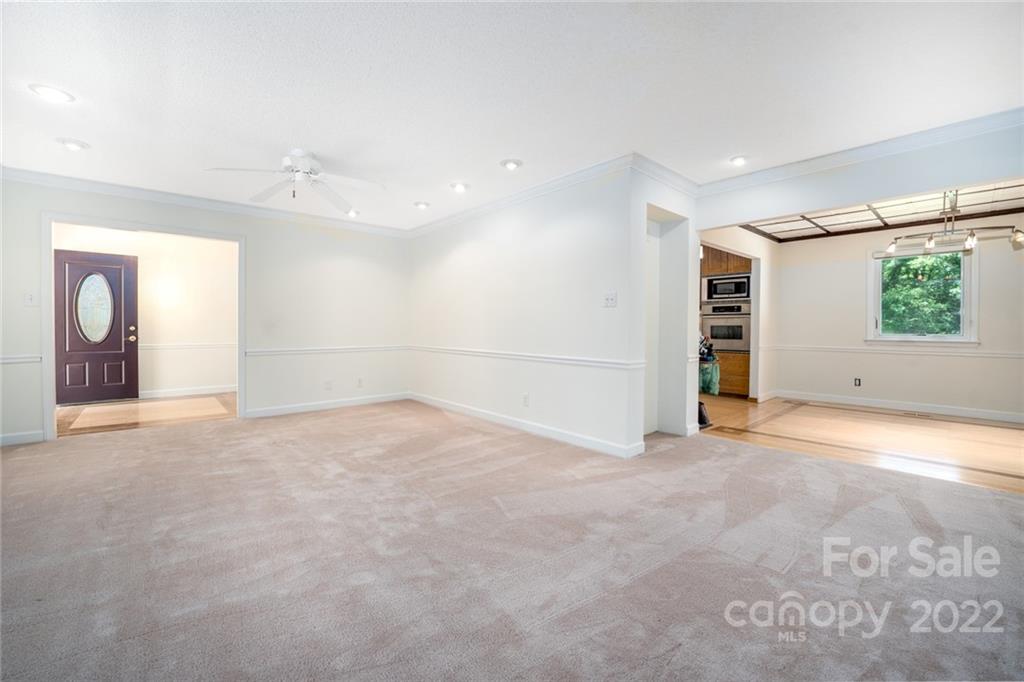 7720 Kinross Drive Oak Ridge, NC 27310 - Photo 11 of 42 an empty room with windows and closet