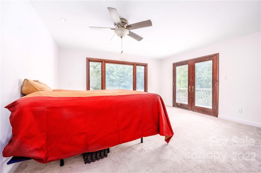 7720 Kinross Drive Oak Ridge, NC 27310 - Photo 23 of 42 a bedroom with a bed and window