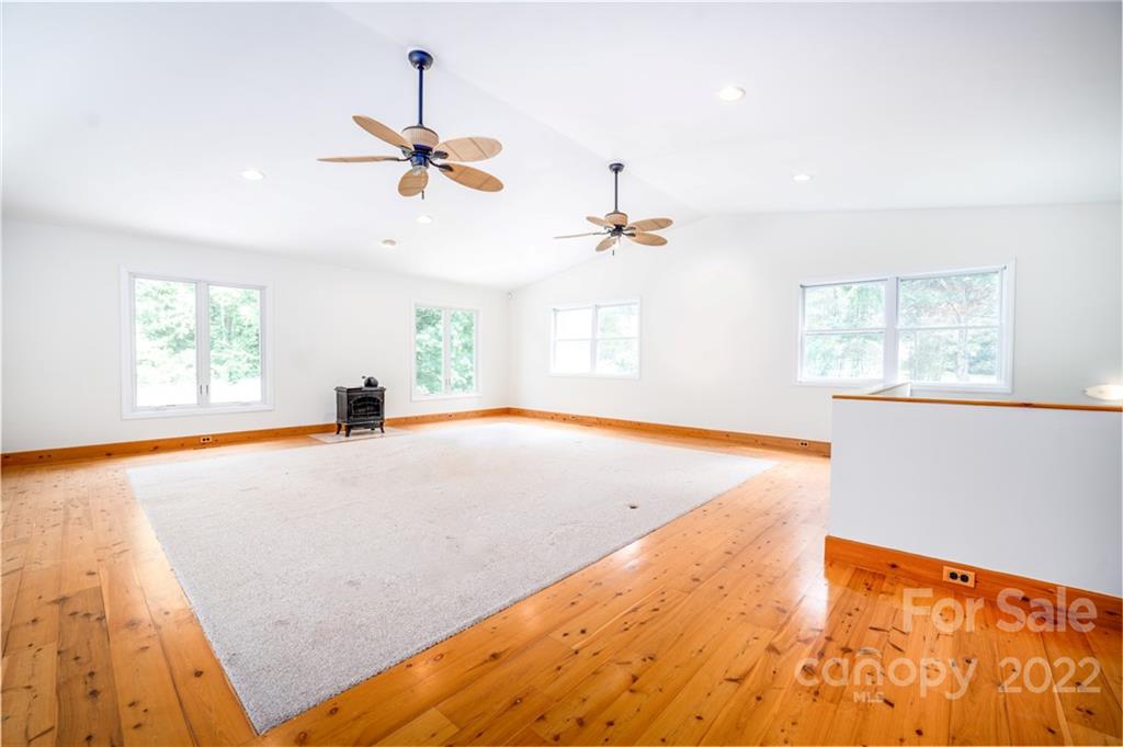 7720 Kinross Drive Oak Ridge, NC 27310 - Photo 27 of 42 a view of a room with window and a ceiling fan