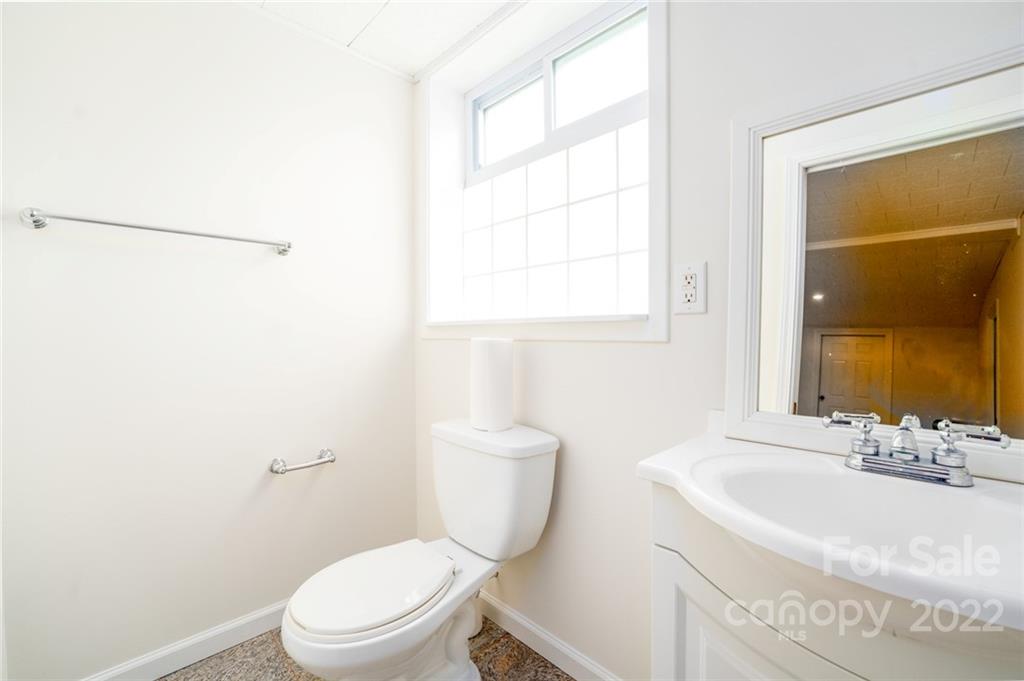 7720 Kinross Drive Oak Ridge, NC 27310 - Photo 32 of 42 a bathroom with a sink a toilet and shower