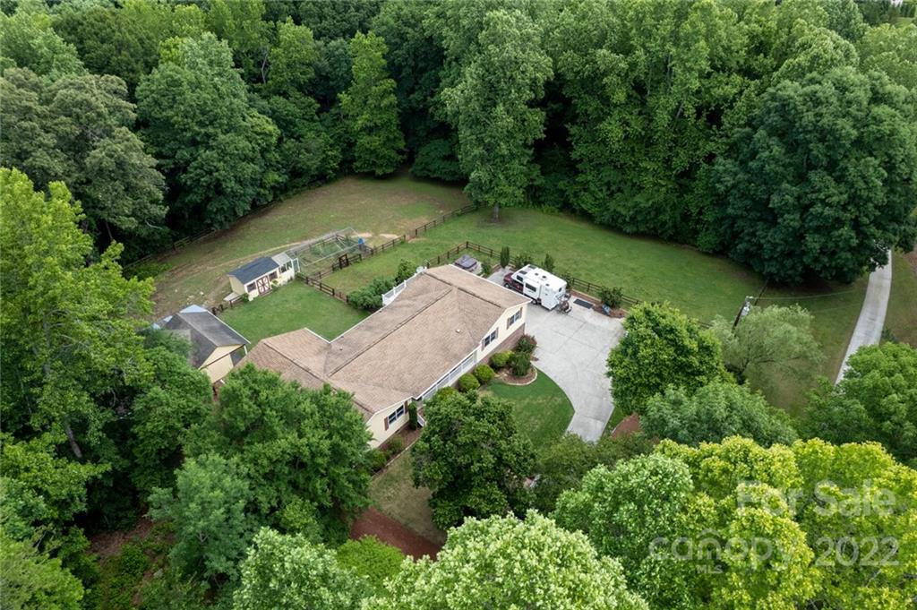 7720 Kinross Drive Oak Ridge, NC 27310 - Photo 33 of 42 an aerial view of a house with a yard and outdoor seating