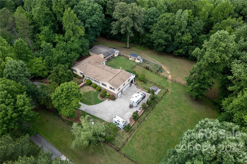 7720 Kinross Drive Oak Ridge, NC 27310 - Photo 34 of 42 an aerial view of a house with a yard