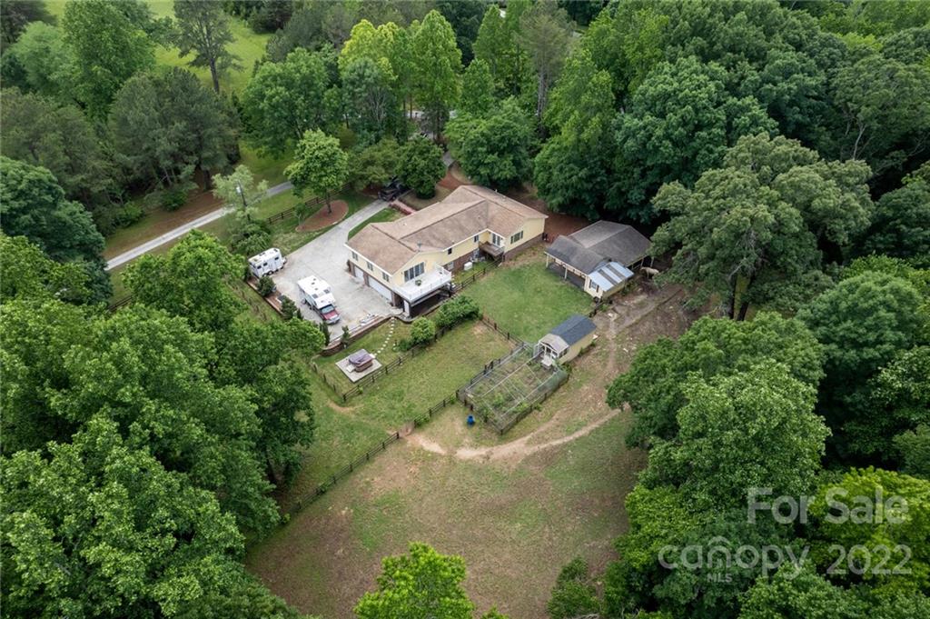 7720 Kinross Drive Oak Ridge, NC 27310 - Photo 35 of 42 an aerial view of a house with a yard