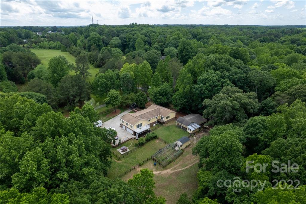7720 Kinross Drive Oak Ridge, NC 27310 - Photo 36 of 42 an aerial view of a house with a yard