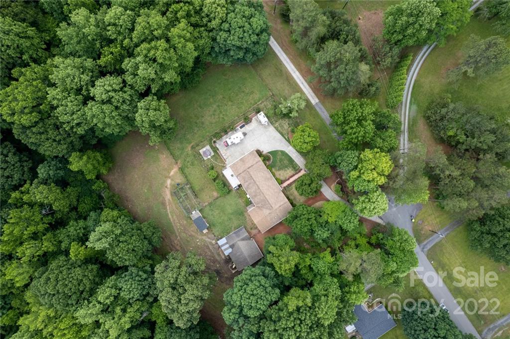 7720 Kinross Drive Oak Ridge, NC 27310 - Photo 38 of 42 an aerial view of a house with outdoor space and lake view