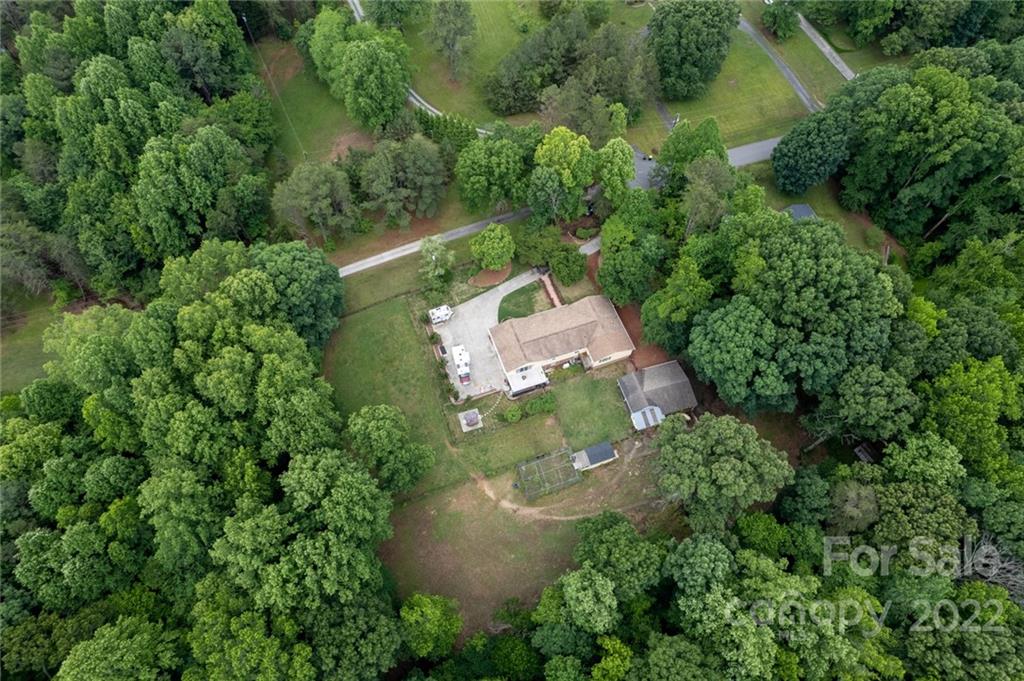 7720 Kinross Drive Oak Ridge, NC 27310 - Photo 40 of 42 an aerial view of a house with a yard
