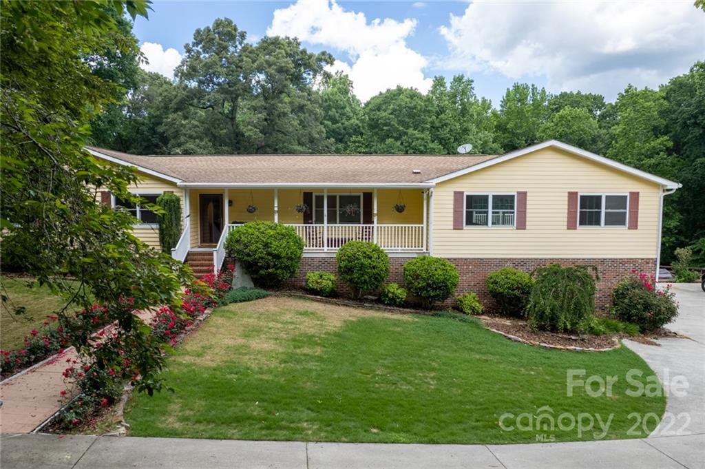 7720 Kinross Drive Oak Ridge, NC 27310 - Photo 41 of 42 a view of a house with garden