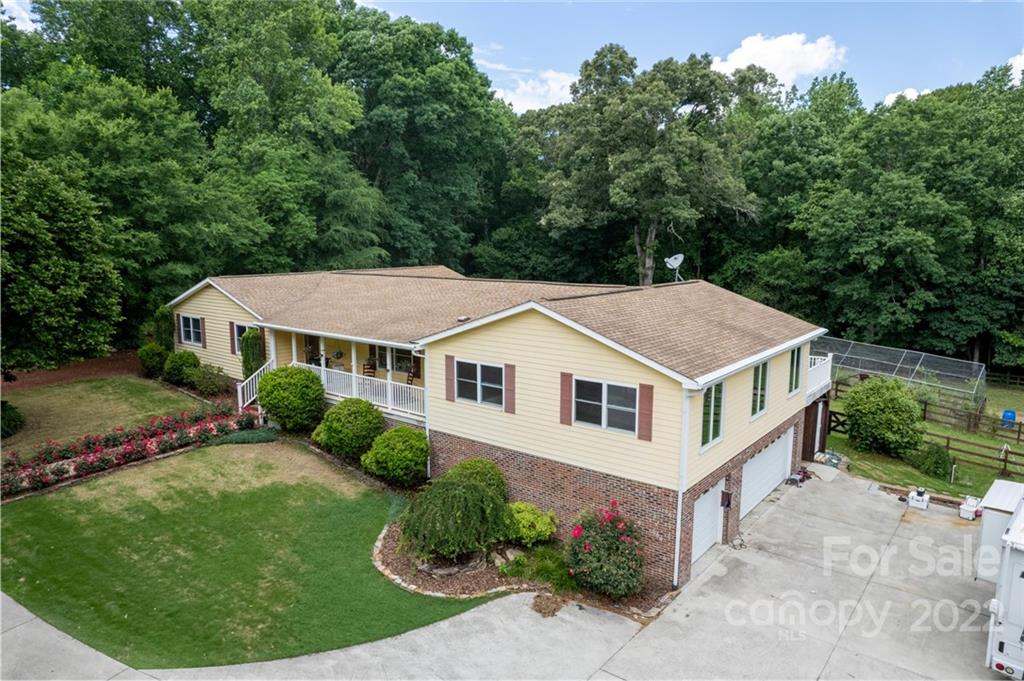 7720 Kinross Drive Oak Ridge, NC 27310 - Photo 42 of 42 a aerial view of a house with a yard