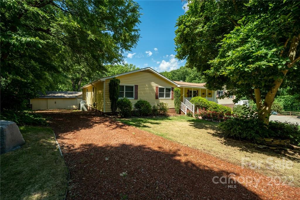 7720 Kinross Drive Oak Ridge, NC 27310 - Photo 5 of 42 a view of a yard in front of house with a yard