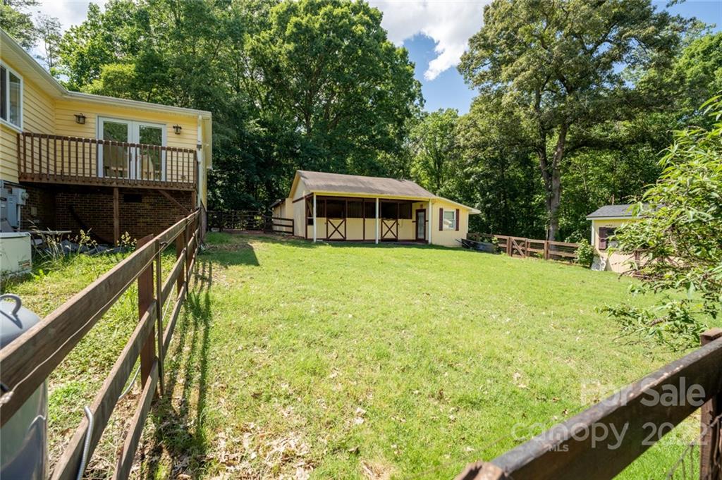 7720 Kinross Drive Oak Ridge, NC 27310 - Photo 7 of 42 a view of house with yard and outdoor seating
