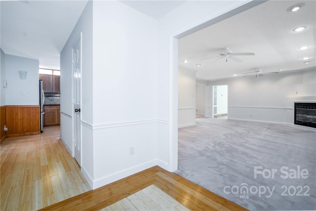7720 Kinross Drive Oak Ridge, NC 27310 - Photo 9 of 42 a view of a room with wooden floor