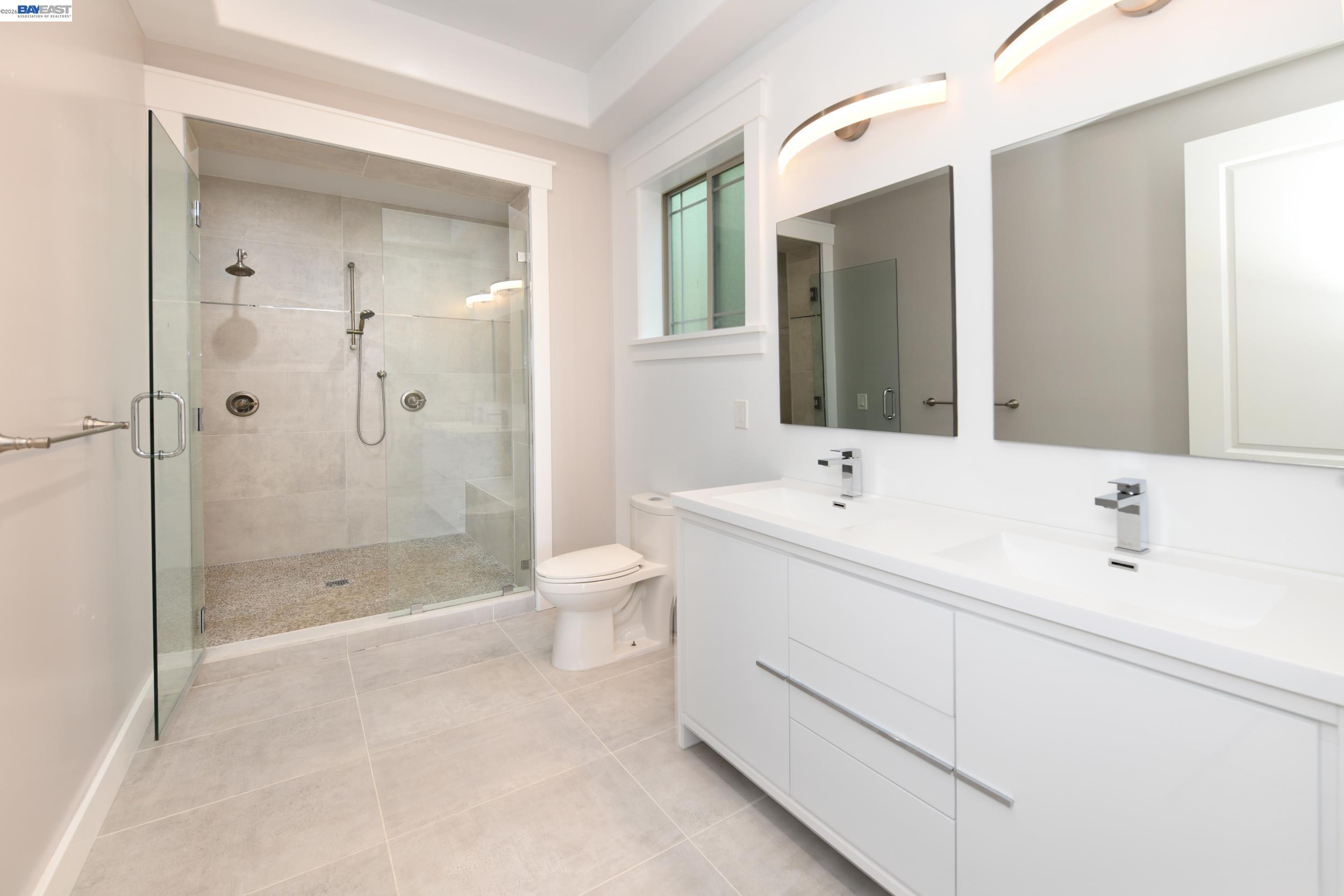 1516 Pleasant Hill Road Lafayette, CA 94549 - Photo 12 of 38 a spacious bathroom with a bathtub shower sink mirror and toilet