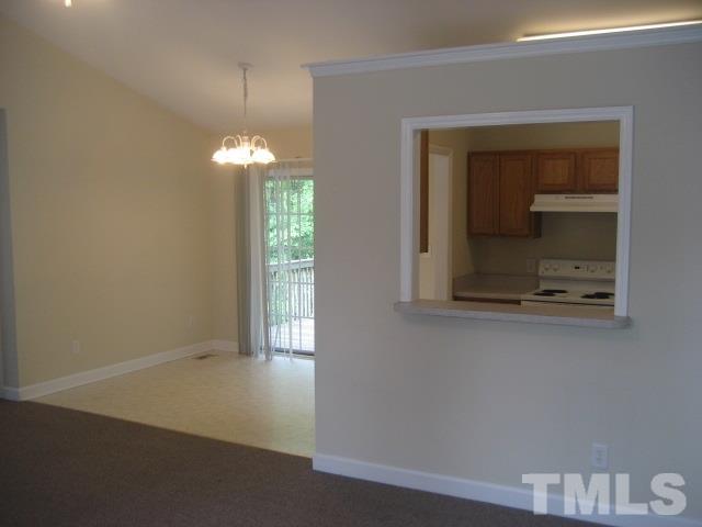 3205 Stedman Drive Raleigh, NC 27607 - Photo 4 of 10 a view of a room with wooden floor and staircase