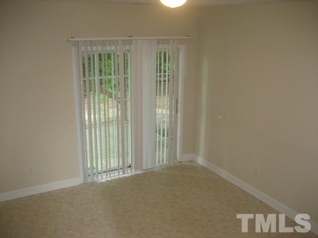 3205 Stedman Drive Raleigh, NC 27607 - Photo 6 of 10 a view of an empty room with a window