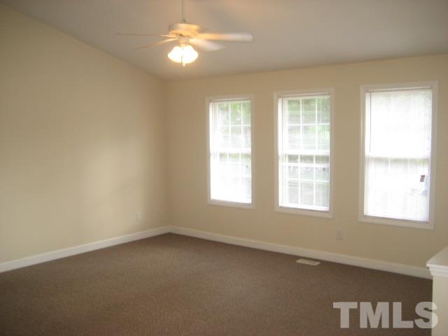 3205 Stedman Drive Raleigh, NC 27607 - Photo 7 of 10 a view of an empty room with a window