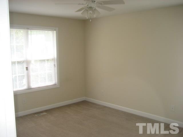 3205 Stedman Drive Raleigh, NC 27607 - Photo 9 of 10 an empty room with a window