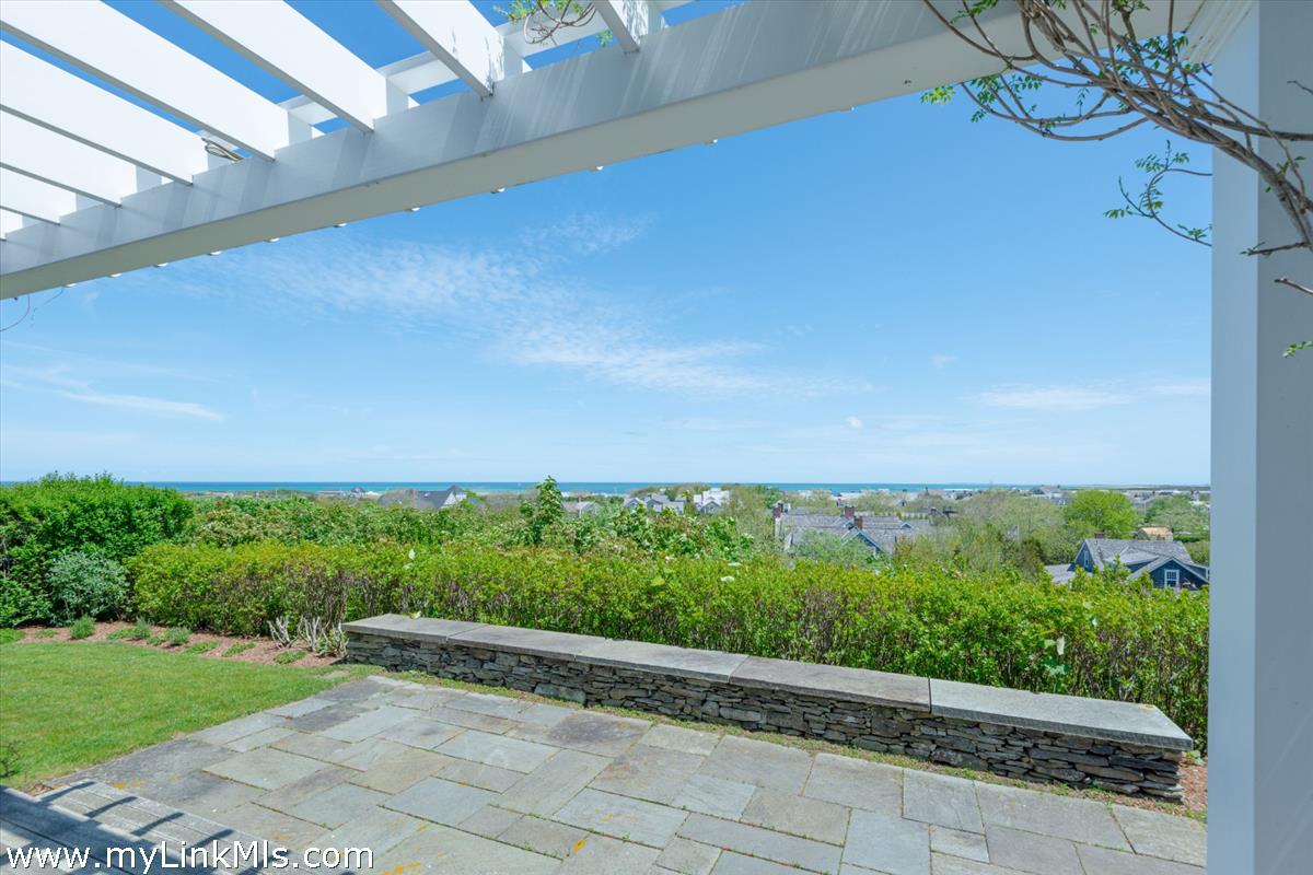 39 Cliff Road Nantucket, MA 02554 - Photo 3 of 46 a view of a garden with an outdoor space