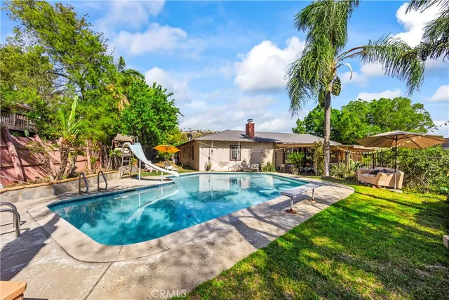 a view of a house with swimming pool