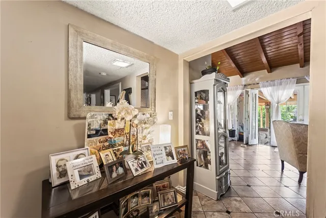 a view of a livingroom with furniture and hardwood floor