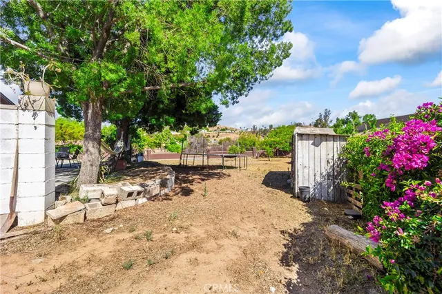 a view of a backyard with sitting area