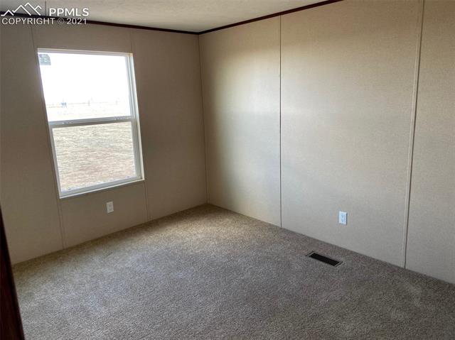 1270 Sengbeil Road Yoder, CO 80864 - Photo 8 of 10 One of 3 additional bedrooms.
