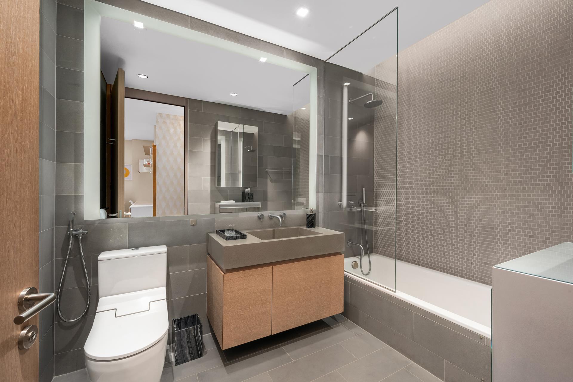 49 Chambers Street, Unit PHB Manhattan, NY 10007 - Photo 13 of 35 a bathroom with a sink a toilet a mirror and bathtub