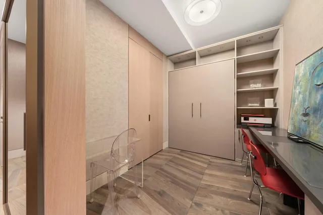 a bathroom with a sink a toilet a mirror and bathtub