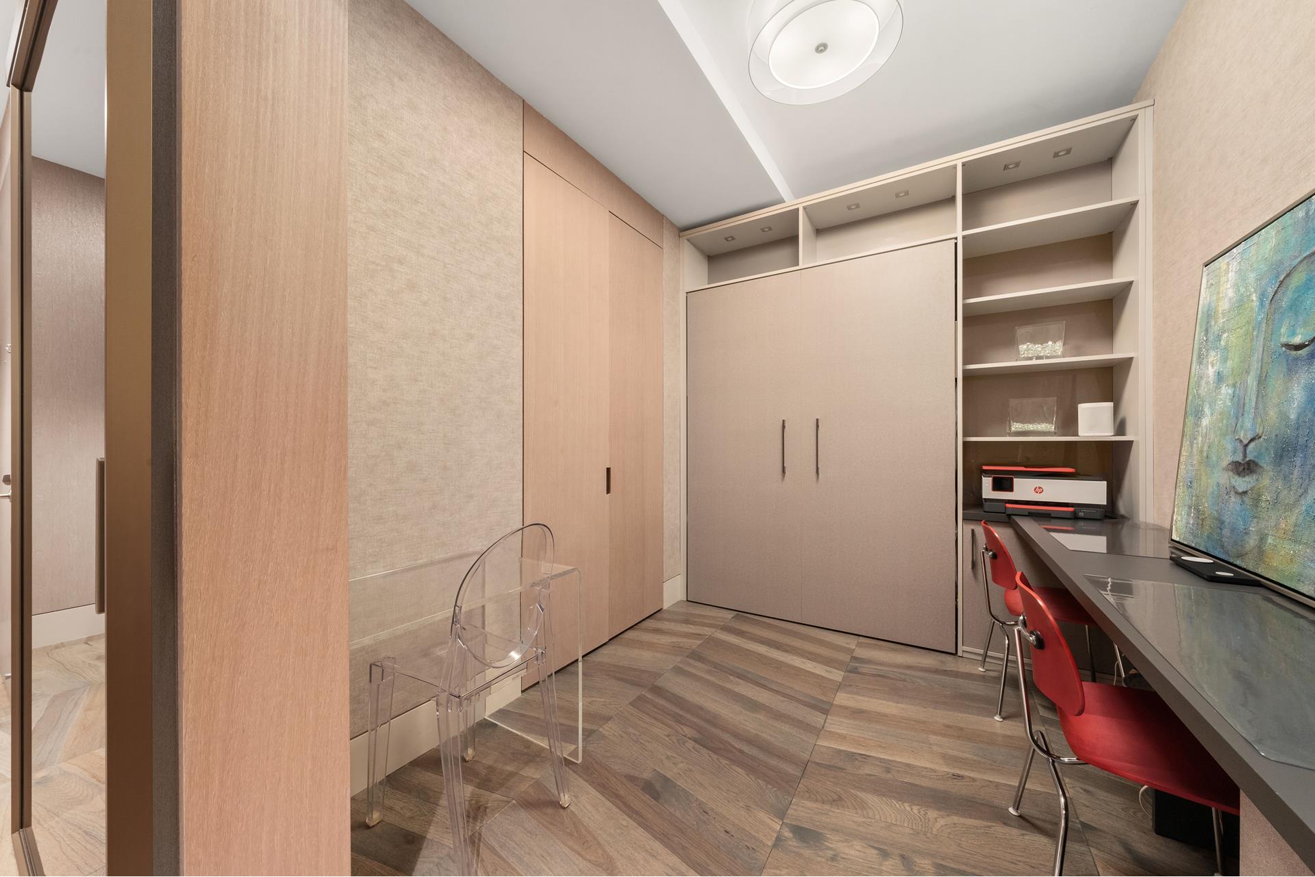 49 Chambers Street, Unit PHB Manhattan, NY 10007 - Photo 14 of 35 a view of room with walk in closet and wooden floor