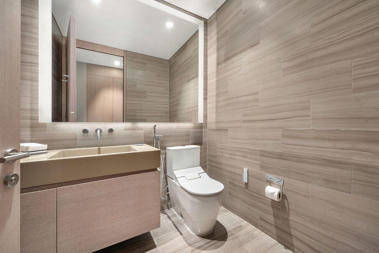 49 Chambers Street, Unit PHB Manhattan, NY 10007 - Photo 15 of 35 a bathroom with a toilet sink and mirror