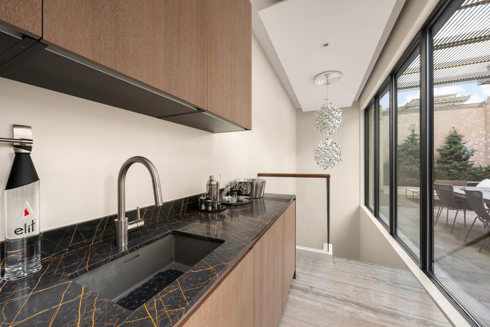 49 Chambers Street, Unit PHB Manhattan, NY 10007 - Photo 19 of 35 a kitchen with a sink and a refrigerator