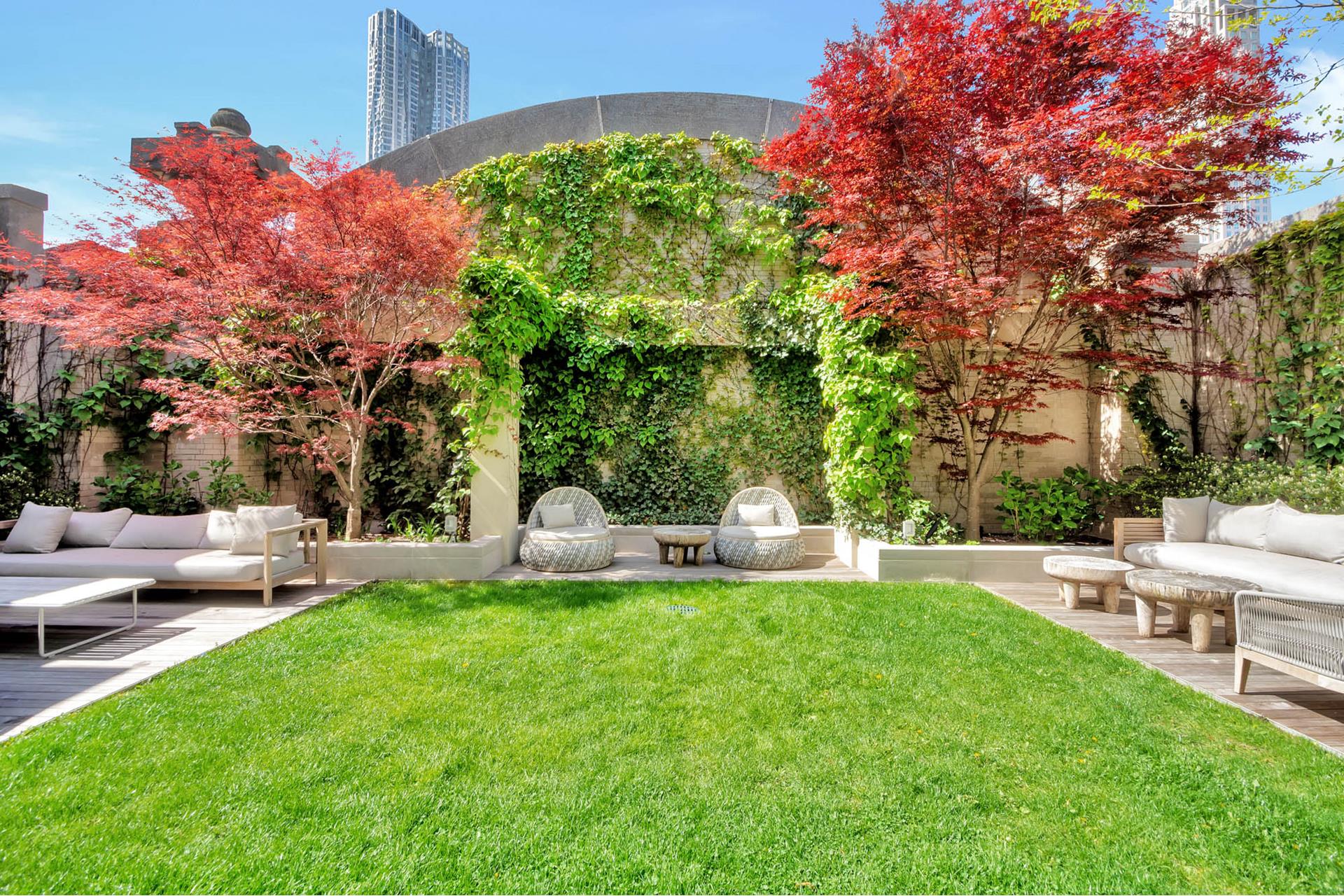 49 Chambers Street, Unit PHB Manhattan, NY 10007 - Photo 23 of 35 a view of a house with a yard and sitting area