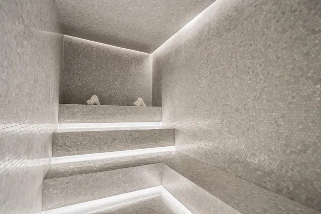 a bathroom with a double vanity sink bathtub and toilet