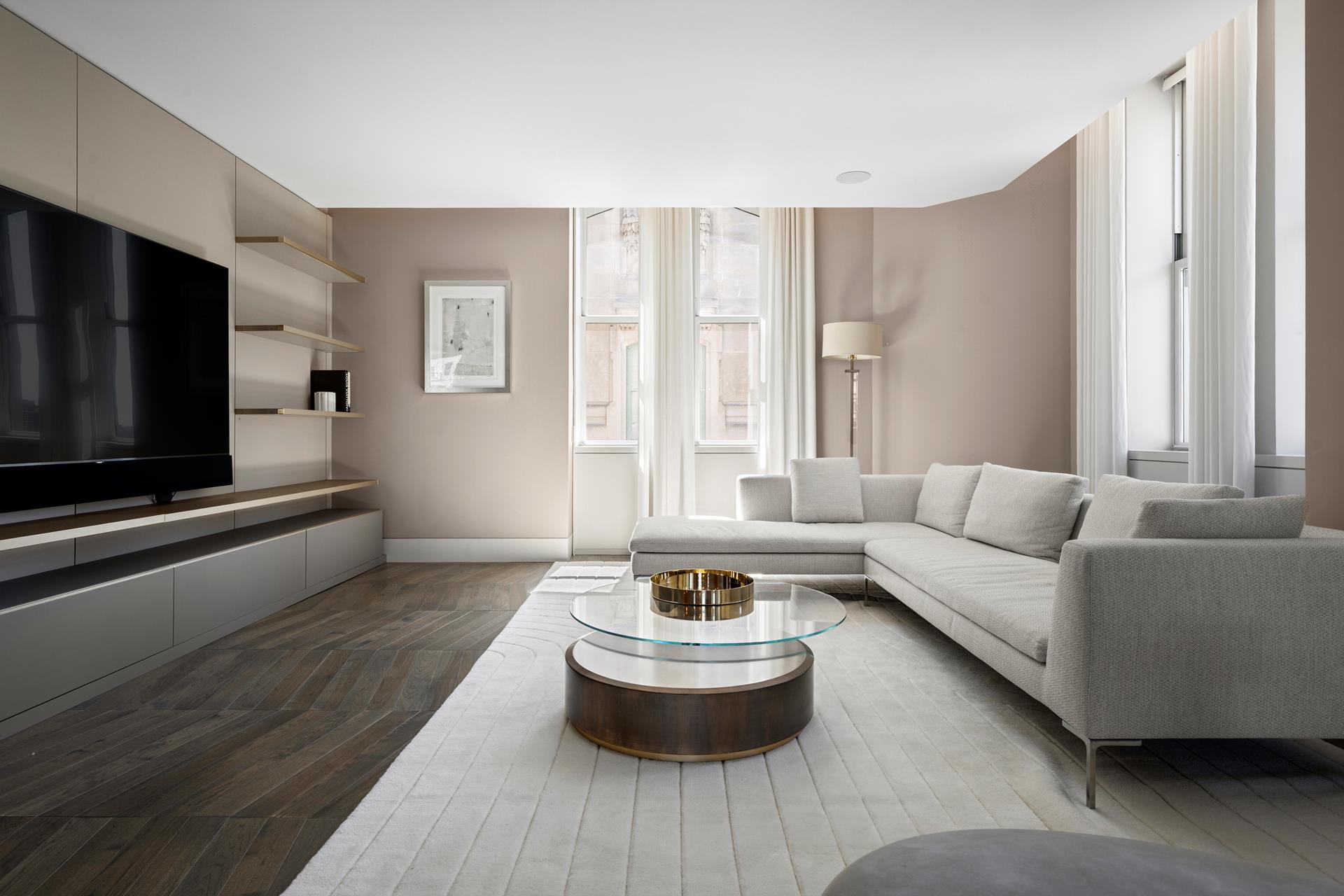 49 Chambers Street, Unit PHB Manhattan, NY 10007 - Photo 4 of 35 a living room with furniture and a flat screen tv