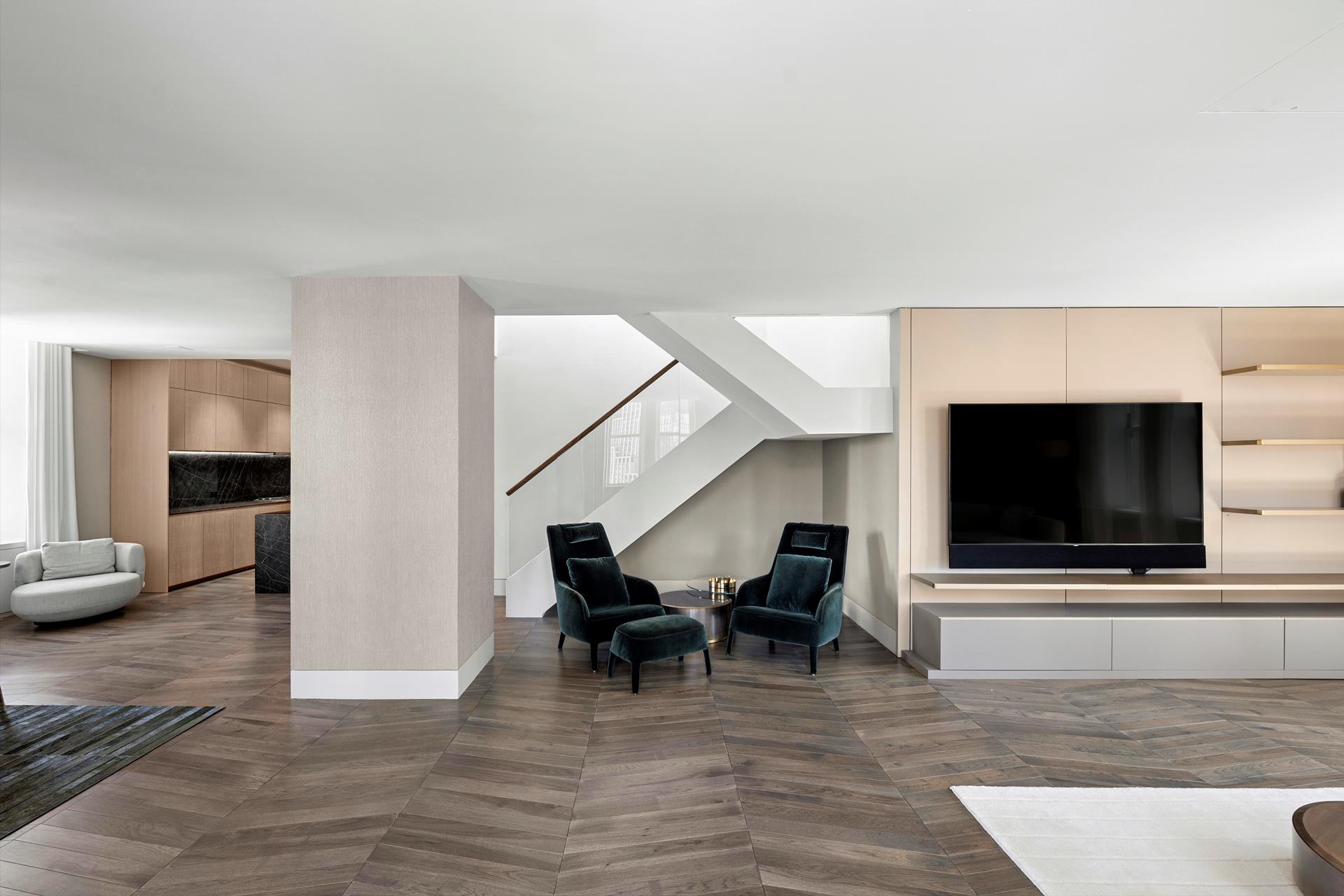 49 Chambers Street, Unit PHB Manhattan, NY 10007 - Photo 5 of 35 a living room with furniture and a flat screen tv