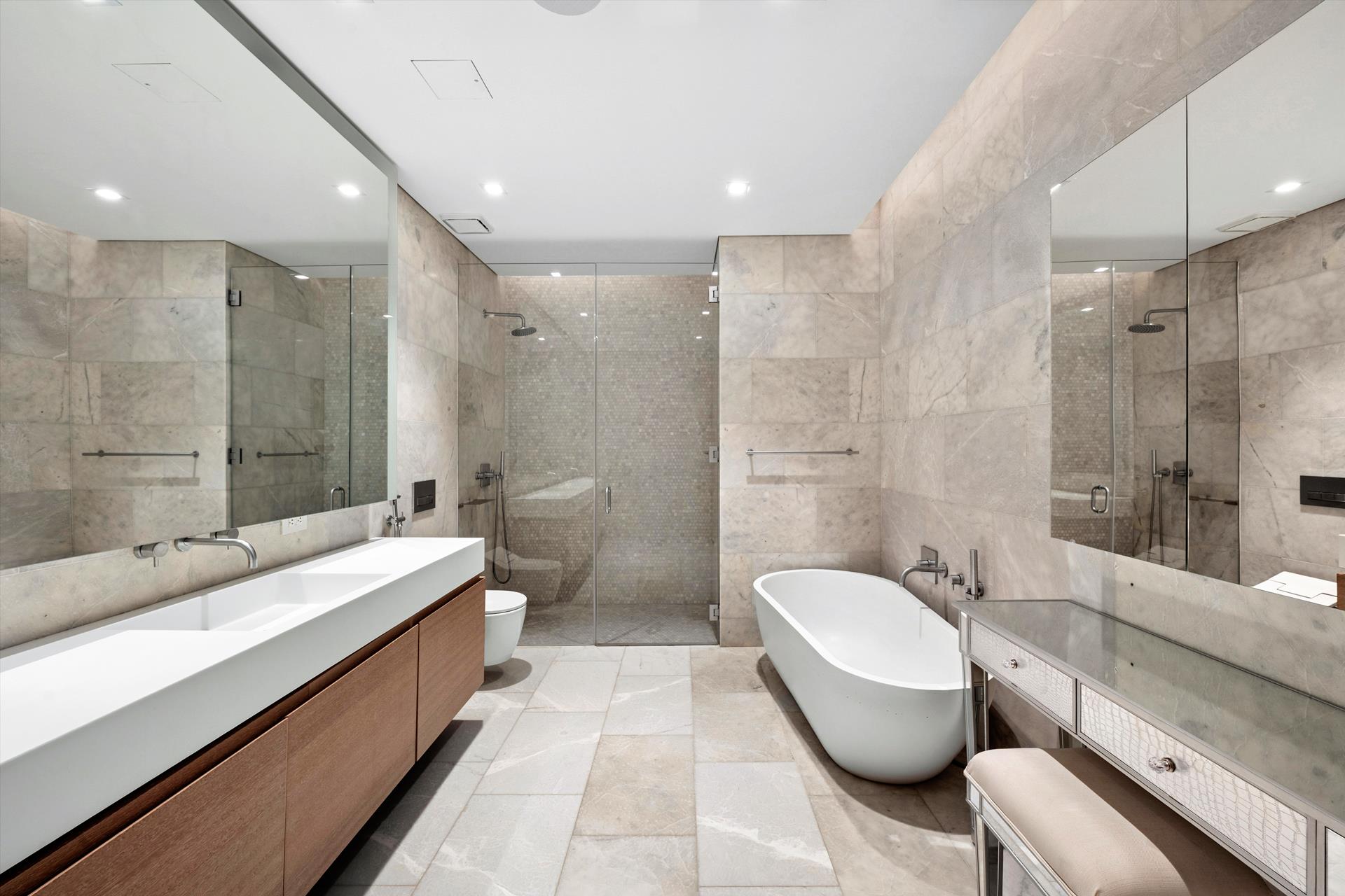 49 Chambers Street, Unit PHB Manhattan, NY 10007 - Photo 9 of 35 a spacious bathroom with a bathtub shower sink and toilet