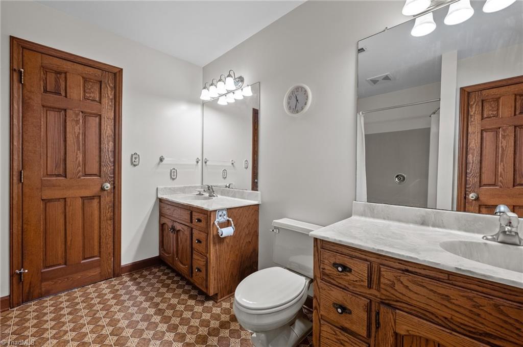 5127 Watchtower Road Julian, NC 27283 - Photo 25 of 39 Upstairs bathroom with dual vanities