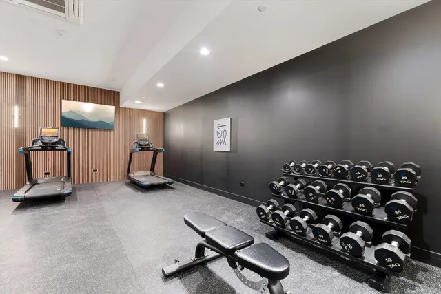 a room with gym equipment and a large window