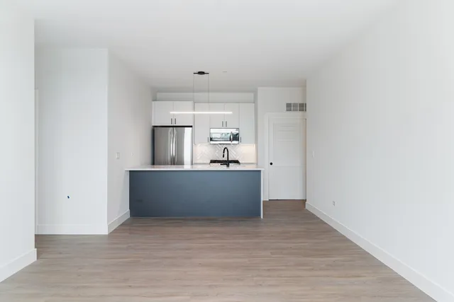 a view of kitchen with wooden floor