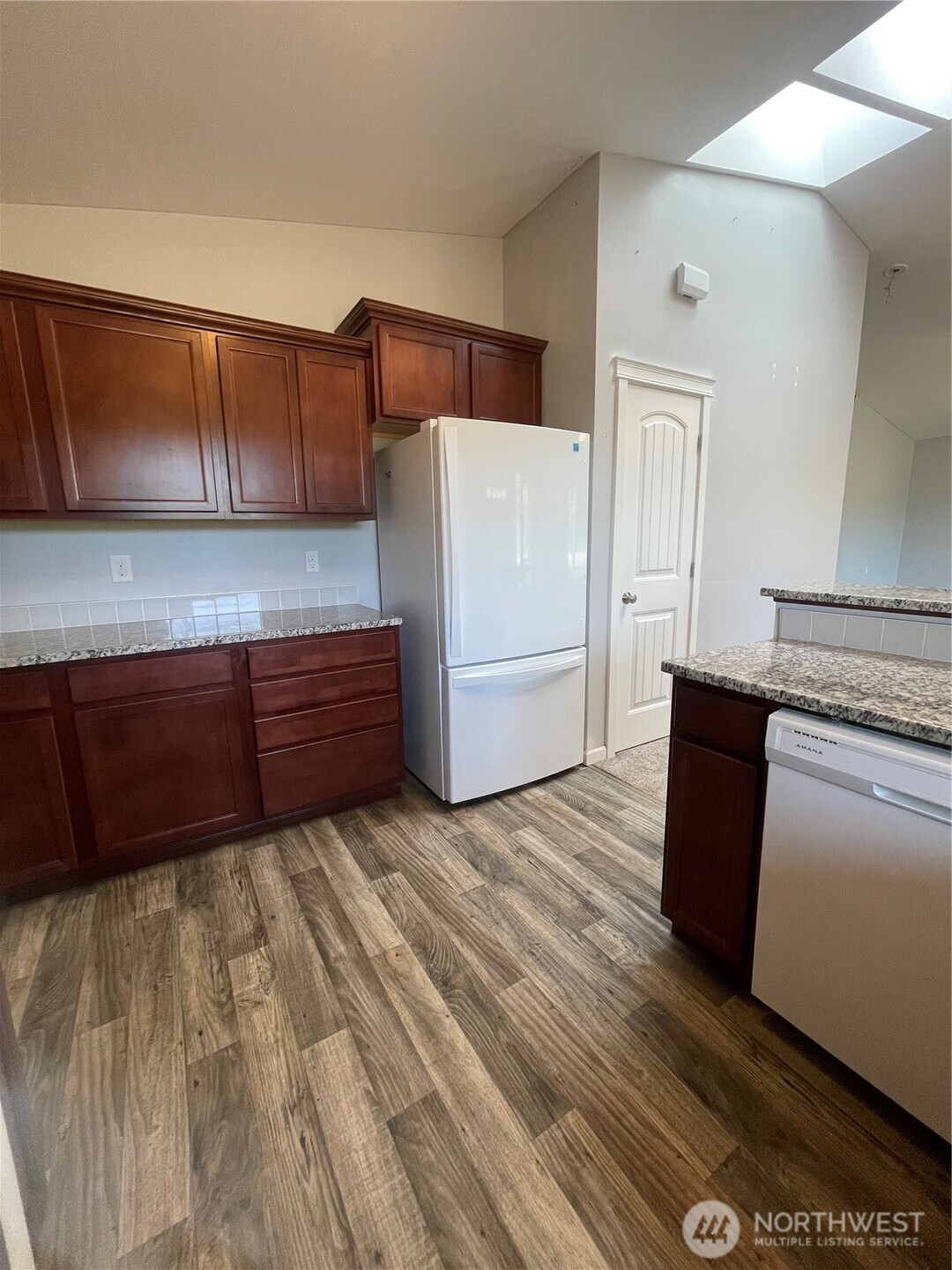397 Bunker Road Chehalis, WA 98532 - Photo 11 of 35 a kitchen with wooden cabinets and a refrigerator