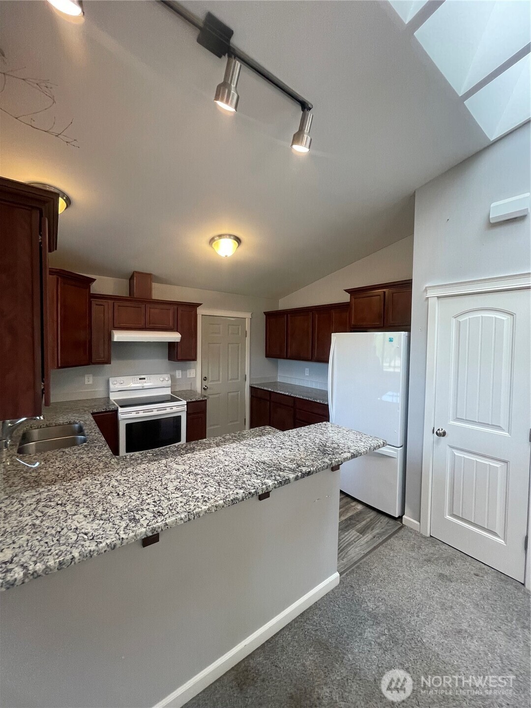 397 Bunker Road Chehalis, WA 98532 - Photo 9 of 35 a kitchen with stainless steel appliances kitchen island granite countertop a refrigerator and stove