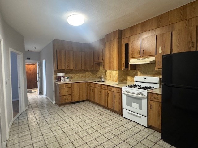 166 A Chelsea Street, Unit 1 Boston, MA 02128 - Photo 1 of 13 a kitchen with stainless steel appliances a refrigerator sink stove and cabinets