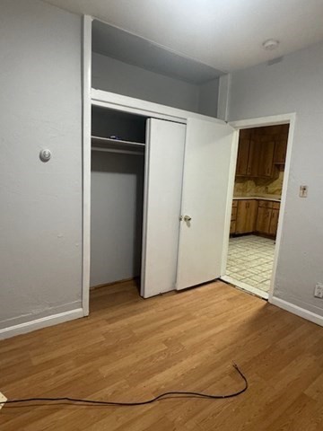 166 A Chelsea Street, Unit 1 Boston, MA 02128 - Photo 12 of 13 a view of empty room with wooden floor