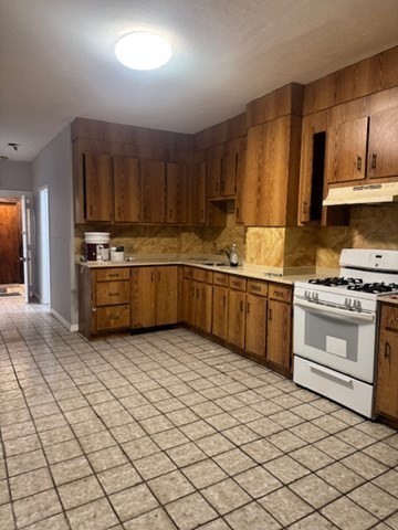 166 A Chelsea Street, Unit 1 Boston, MA 02128 - Photo 2 of 13 a kitchen with stainless steel appliances granite countertop a sink and cabinets